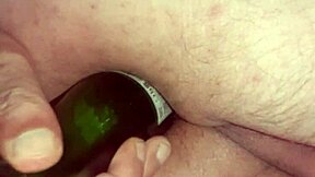 Gay boy enjoys anal pleasure with a bottle in his ass