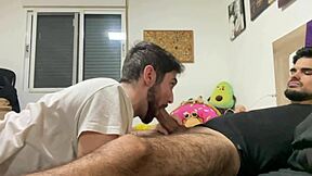 Latino twink gets his uncut cock sucked by a man