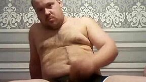 A gay man with an average body weight pleasuring himself
