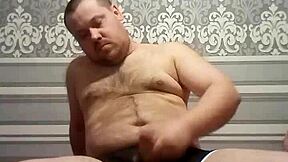 fat gay man stroking his handsome cock in solo action