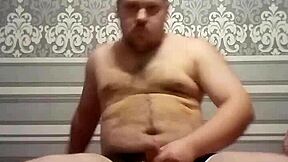 A gay man with an average body weight pleasuring himself