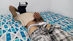 Enjoying solo pleasure with VR glasses while watching porn