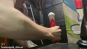 Young and straight twink gives a blowjob to a big cock toy in the form of a horse