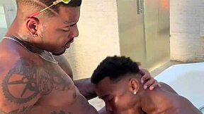 Two big black cocks in a motel bathroom