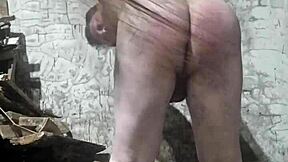A fat Russian man endured a brutal spanking. His huge ass took a beating from a dirty broom.