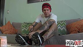 Tattooed guy creeps on feet in socks