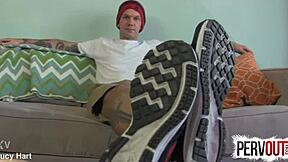 Tattooed guy creeps on feet in socks