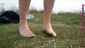 Amateur guy teases in nylon pantyhose fetish solo at public beach during vacation.