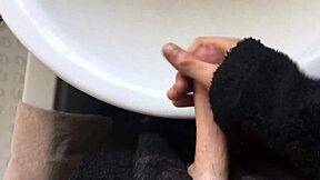 Solo gay twink masturbates and squirts in the bathroom with big cock blowjob