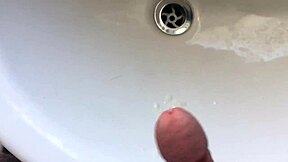 Solo gay twink masturbates and squirts in the bathroom with big cock blowjob