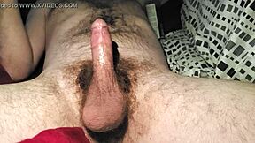 Stroking my cock alone in bed until I reach orgasm