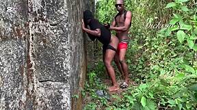 ebony dancer stretched deep behind the fence