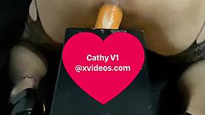 cathyv1 pushes a thick dildo deep into her ass