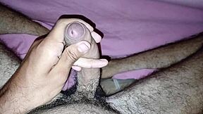Young man masturbates his flaccid cock until it’s rock hard