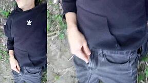 this cute gay boy humps and cums outdoors with cock out