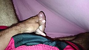 Masturbating Under The Sheets In Shorts Showing Off A Beautiful Large Cock