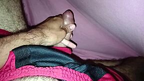 Masturbating Under The Sheets In Shorts Showing Off A Beautiful Large Cock