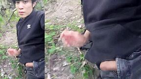 this cute gay boy humps and cums outdoors with cock out