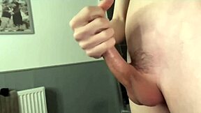 Hot twink jerks his huge cock on camera