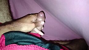 Masturbating Under The Sheets In Shorts Showing Off A Beautiful Large Cock