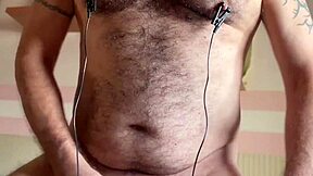 Kilusbear shocks his bear nipples with electro until cum explodes