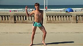 Twink Dancing on Beach with Bulging Speedo